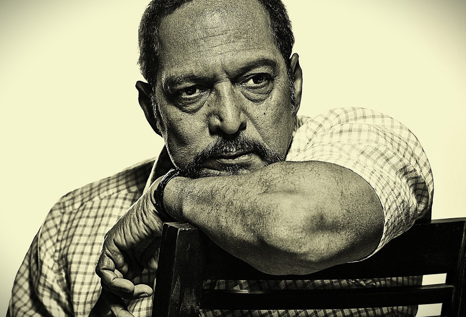 "A poignant and thoughtful portrait of veteran actor Nana Patekar, showcasing his intense gaze and expressive persona."